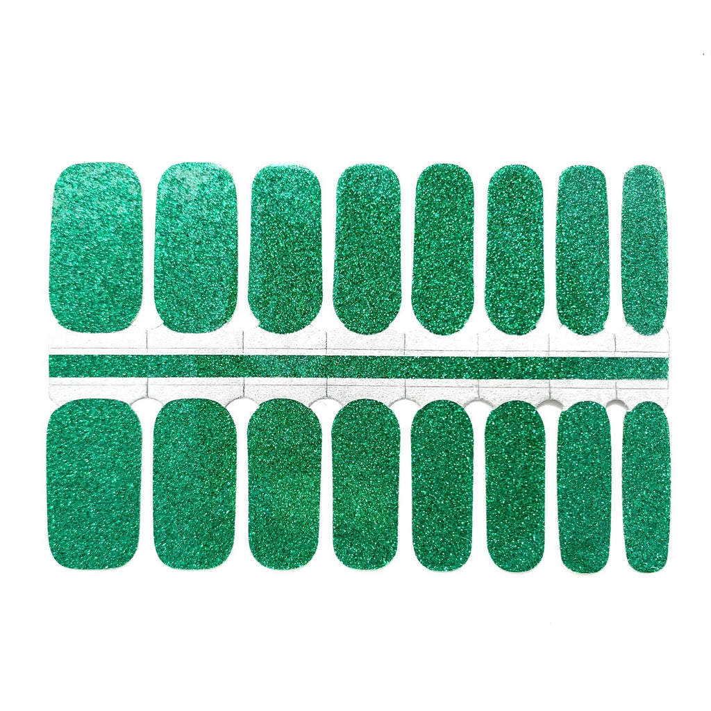 Image of Sparkling Emerald nail wraps by Nails Mailed, displaying a luxurious solid emerald green glitter against a pristine white background. These nail stickers are perfect for achieving glittering emerald nails, offering a DIY solution for a radiant and sophisticated look at home.