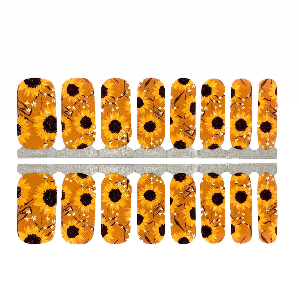 Nails Mailed's Sunflower Nail Wraps displayed against a white background, highlighting the vibrant yellow and orange sunflower graphics on the nail stickers.