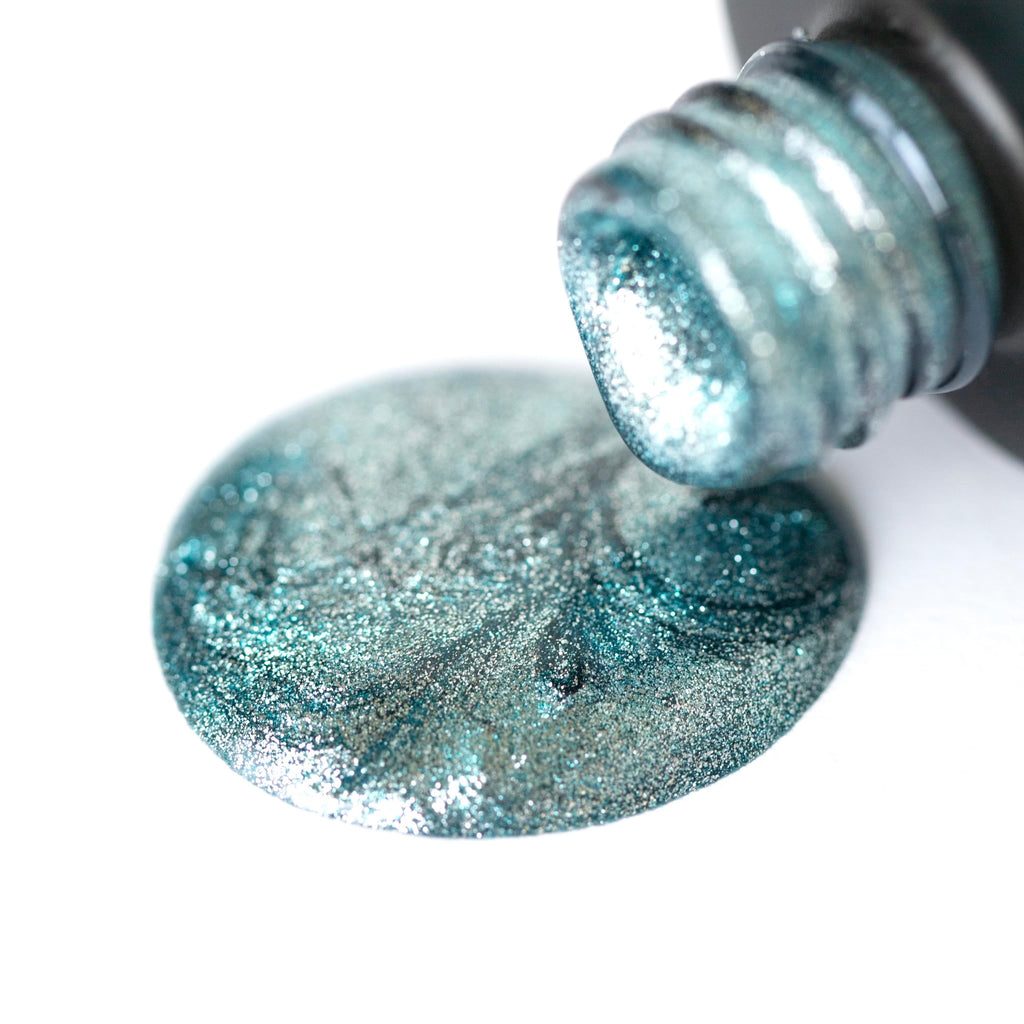 A bottle of Aqua Party Shellac Gel Polish, a glittery aqua shade with a shimmer finish, on a white background. The bottle has a black cap and the polish appears smooth and glossy. A brush is attached to the cap.