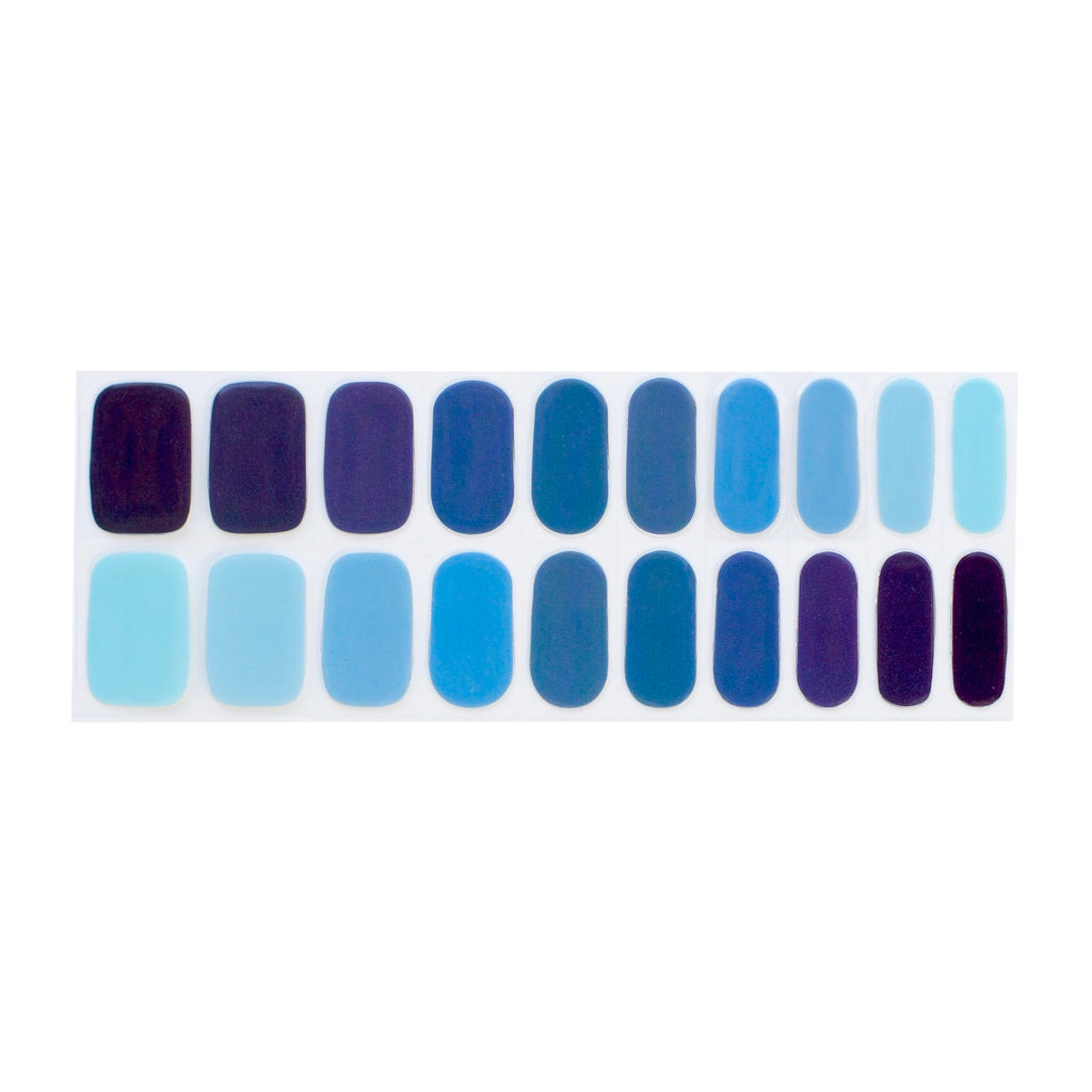 Image displaying Blue Peas in a Pod nail wraps by Nails Mailed, featuring a stunning gradient nails design with various shades of blue. The multicolor nails showcase a seamless transition between hues, offering a unique and stylish DIY nails experience.- Nails Mailed