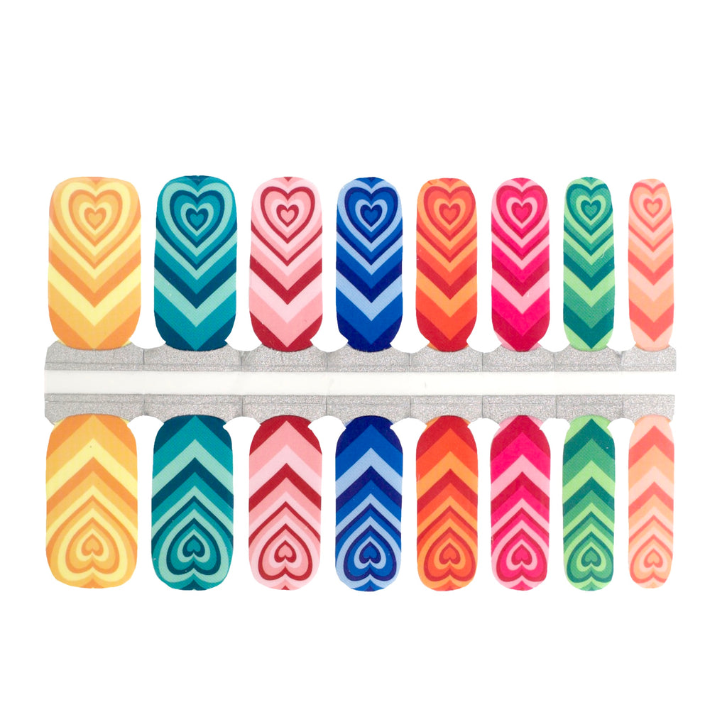 Chasing Rainbows nail wraps with rainbow colors on a white background. Get bold and colorful rainbow nails with this set of nail wraps.