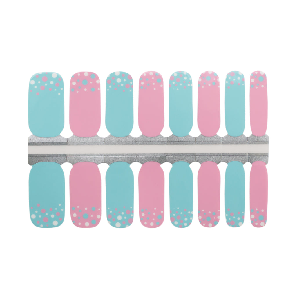 Photo of Fairy Frolic Polka Dot Nail Art Strips, featuring nail wraps in soothing pastel hues of blue and pink. Near the cuticle, playful polka dots in white, pink, and blue add a whimsical charm. The product is displayed against a white background, highlighting its vibrant and joyful design