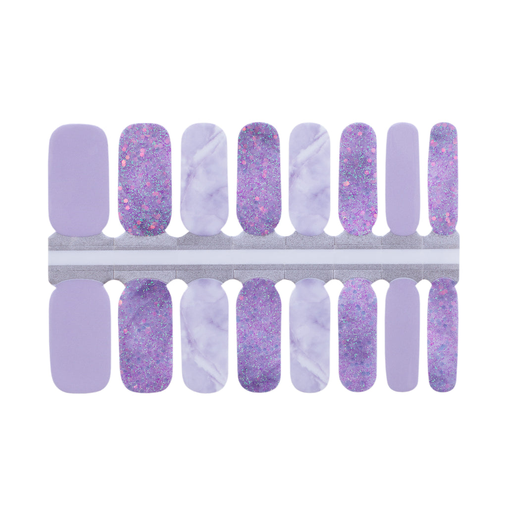 Close-up image of Purple Twilight Classic Nail Wraps, featuring a light lavender base with accents of bold purple glitter and intricate purple marble designs.
