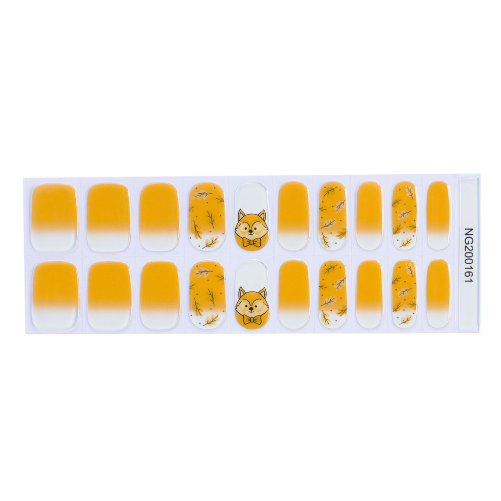 Sunny Harvest gel nail strips displayed against a white background, featuring a clear base with yellow ombre, leaf accents, and a fox design
