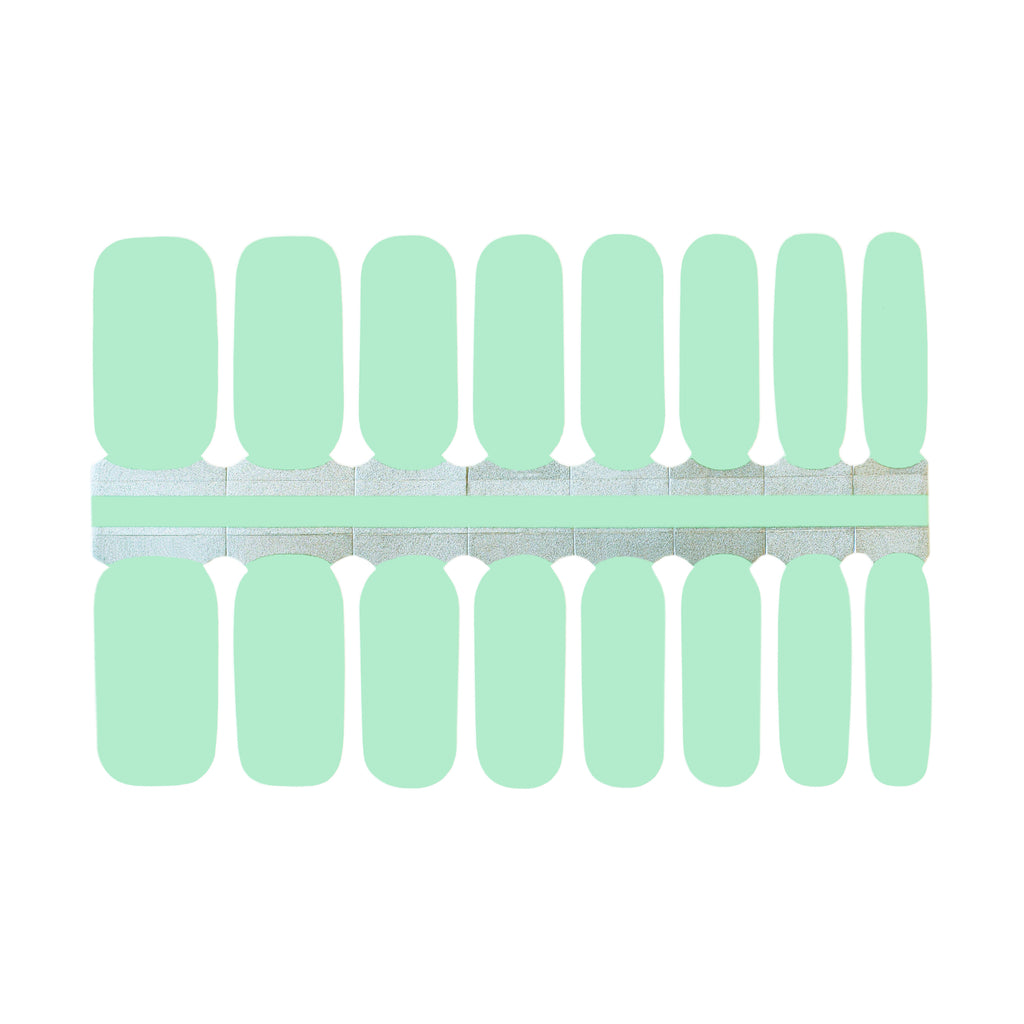 A close up of Soft Green nail wraps on a white background. The wraps feature a lively and vibrant shade of mint green and are made of high quality materials. The wraps are easy to apply and remove, making them a convenient choice for any manicure.
