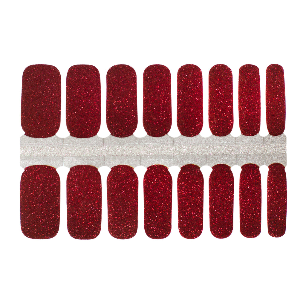 A photo of Burgundy Sparkles nail wraps on a white background. The nail wraps feature a deep burgundy color with sparkling glitter accents, adding a touch of glamour to any manicure. The wraps are rectangular in shape and are lined up next to each other in the photo. The edges of the wraps are slightly curved to fit the shape of a fingernail. The photo is well-lit, and the white background provides a clean and simple backdrop for the product.