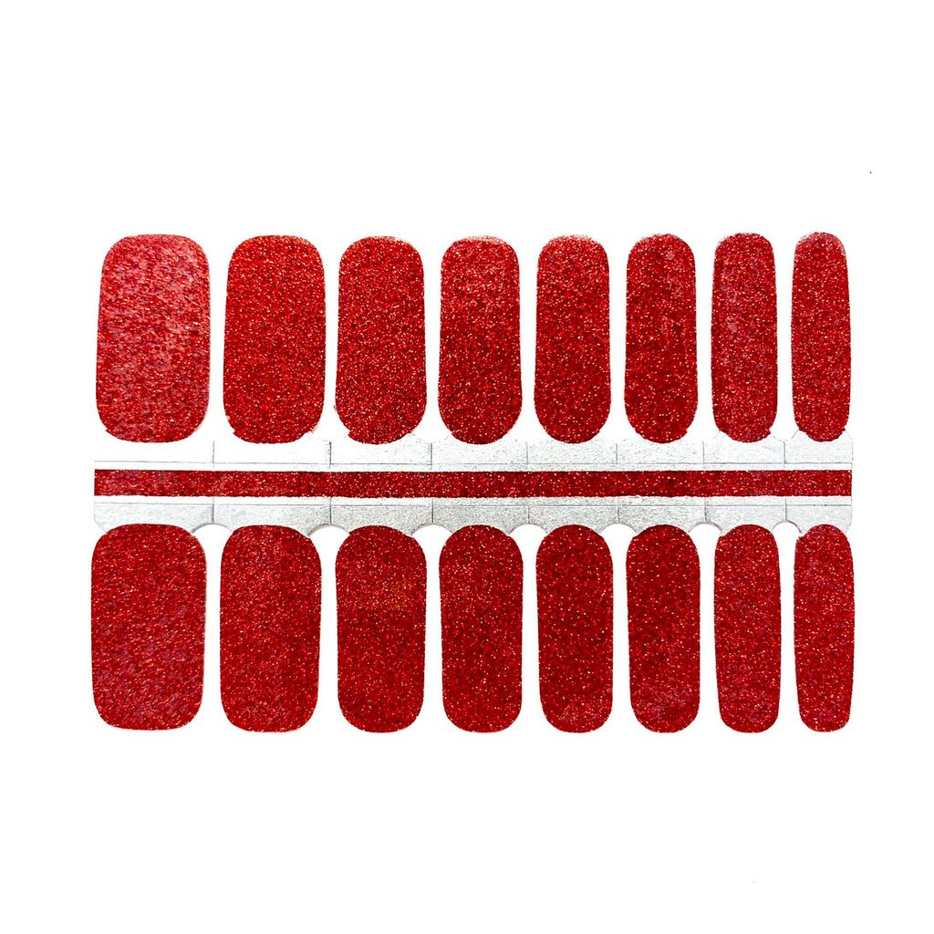 A close-up of Sparkling Cherry nail wraps on a white background. The wraps feature a bright and playful red glitter and are made of high-quality materials. The wraps are easy to apply and remove making them a convenient choice for any manicure.