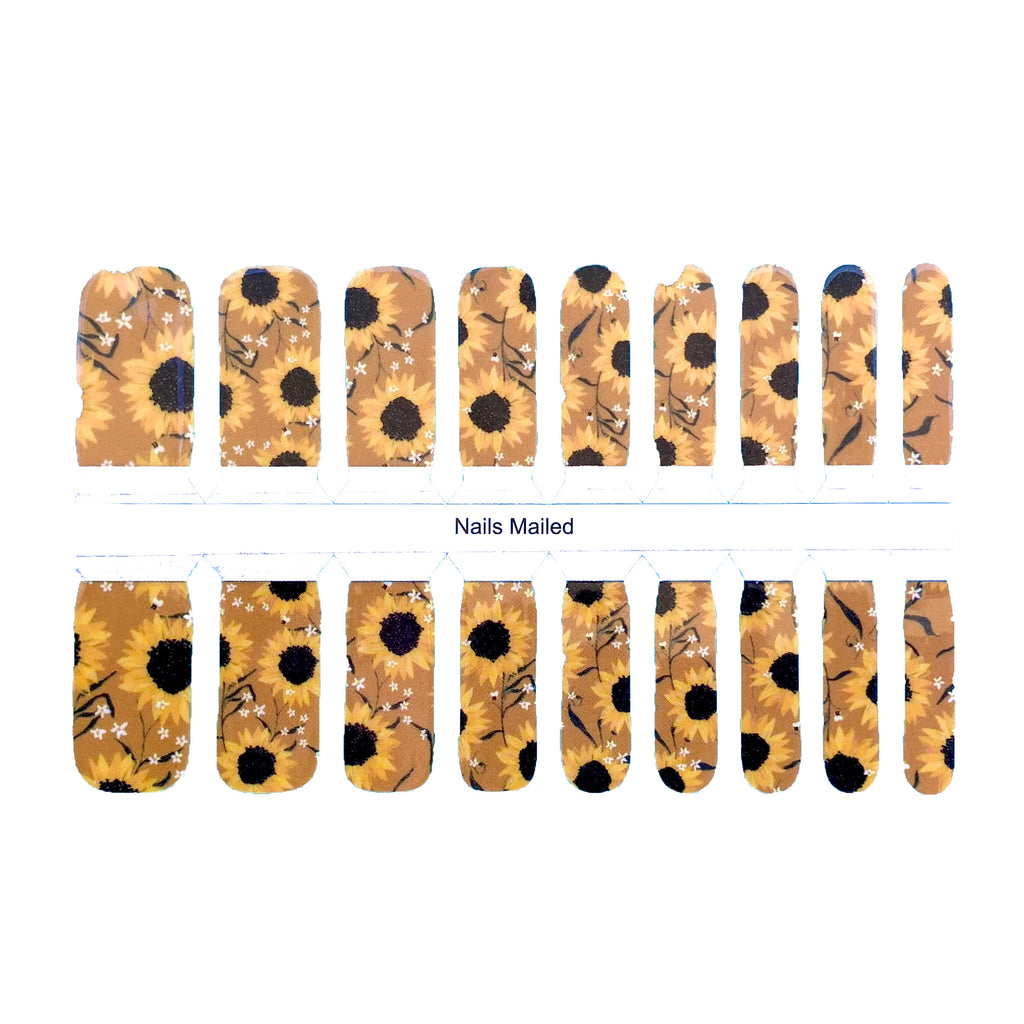 A close-up image of "Sunflower" nail wraps against a white background, showcasing a bright yellow base with bold sunflowers in orange, perfect for adding a touch of whimsy and fun to any kid's look.