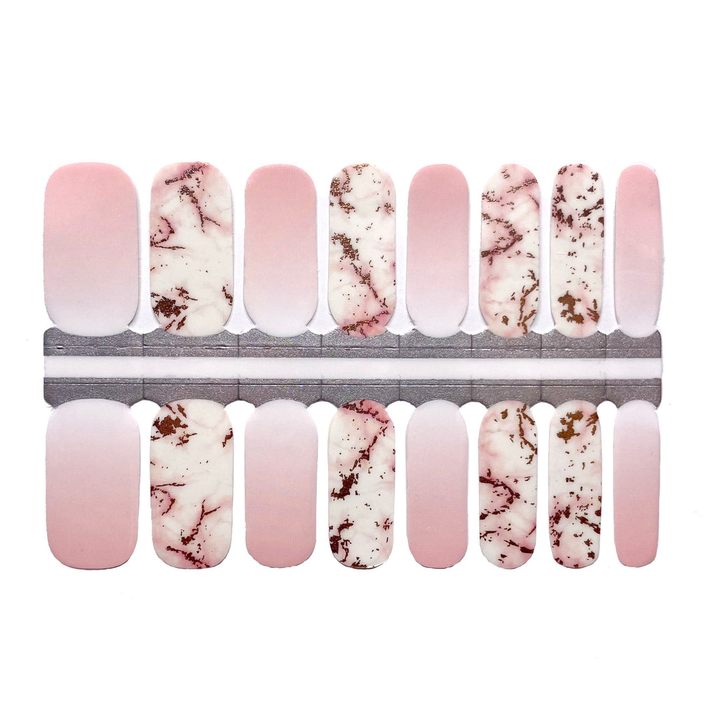 close up of rose gold marble nail wraps on a white background a luxurious choice for any manicure