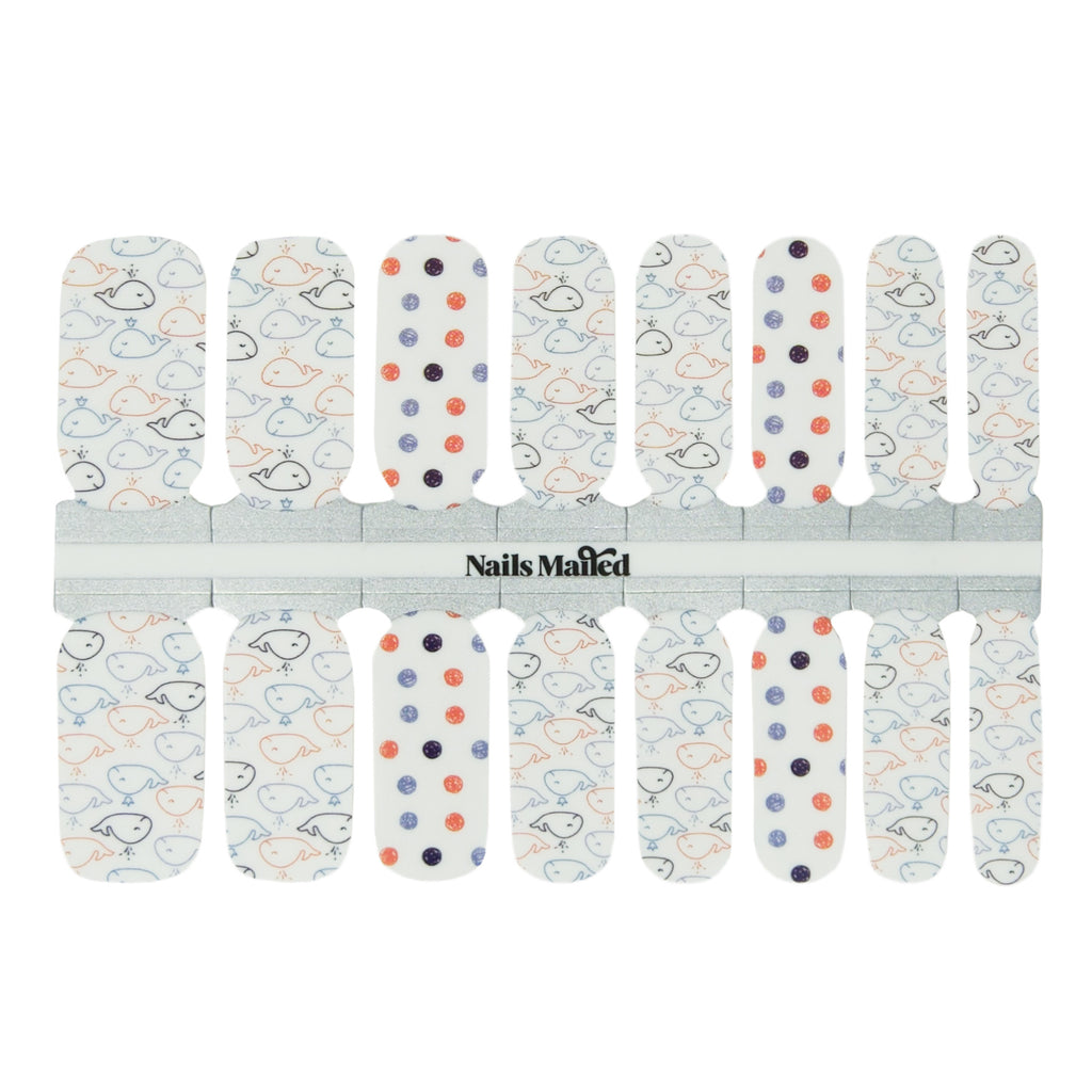 Whale Hello nail wraps against a white background, featuring a white base with blue and orange whale graphics and polka dot accent nail design.