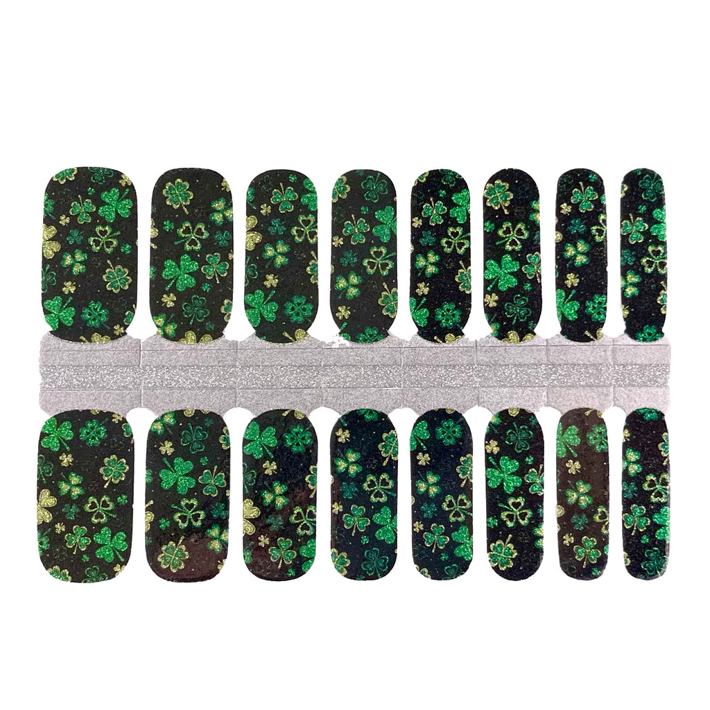 Glitter Shamrock nail wraps on a white background. The wraps feature shimmering shamrock designs and are made of high-quality materials. A perfect choice for any St patrick's day occasion.