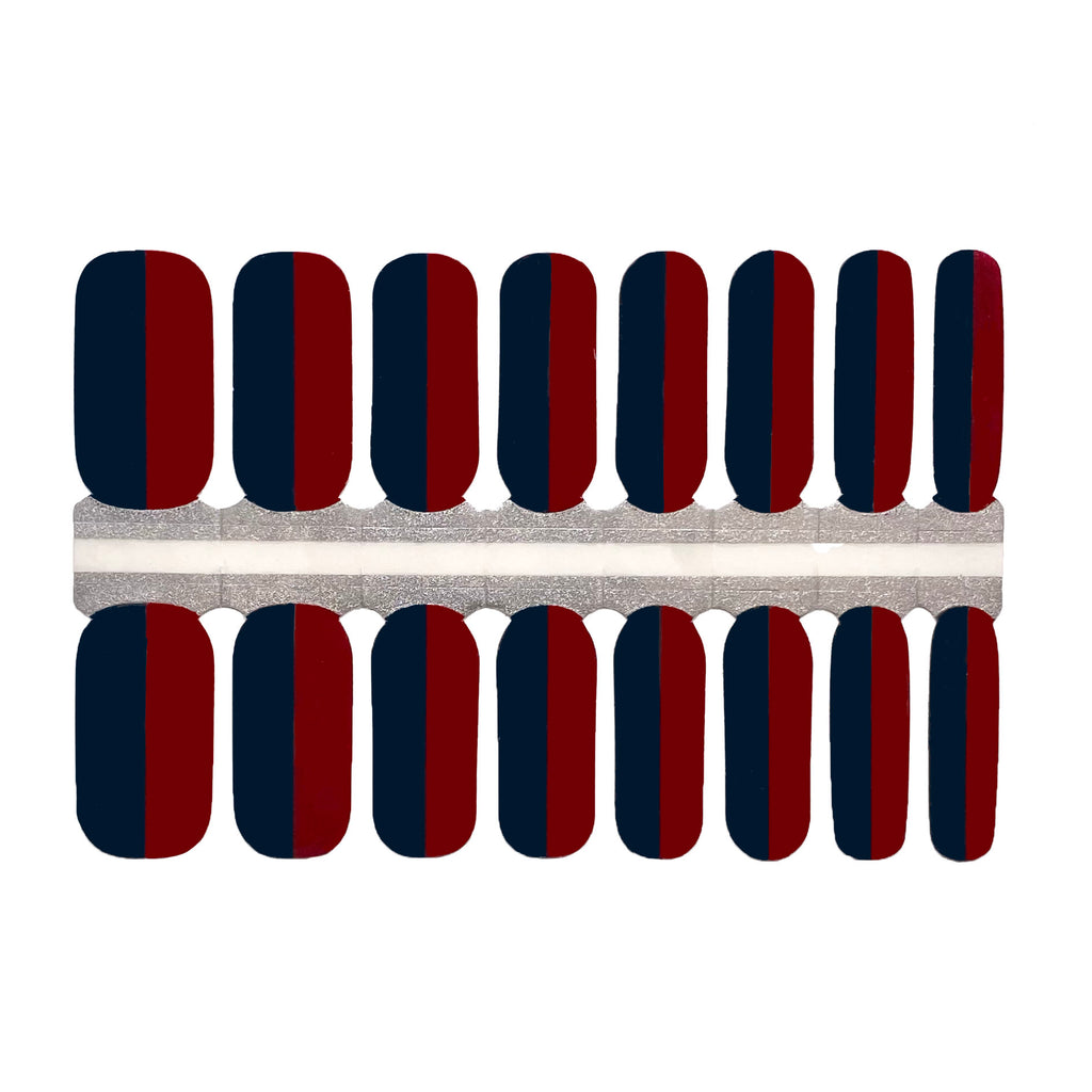 A close-up image of "Red & Navy" nail wraps against a white background, featuring a vertical line dividing the navy and dark red colors, providing a timeless and sophisticated look. Perfect for any occasion, this set of nail wraps is an elegant and stylish addition to any outfit.