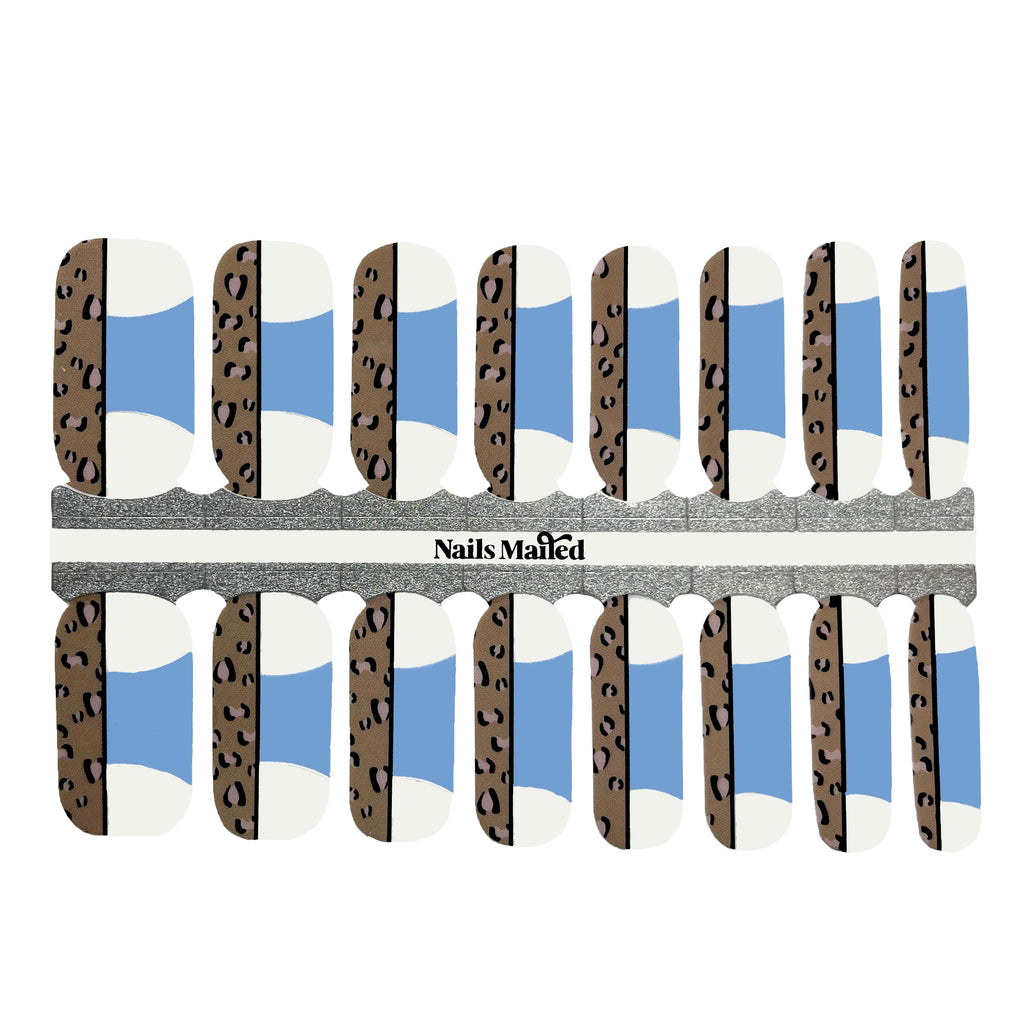 Leopard French Tips nail wraps against a white background, displaying clear base with a blue French tip and a strip of edgy leopard print, creating a modern and playful yet sophisticated design.
