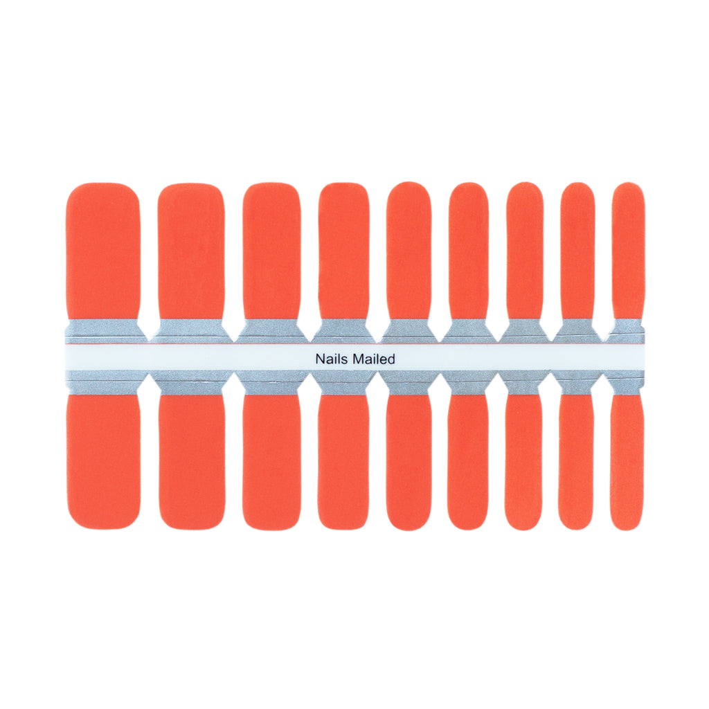 These cute nail wraps for kids feature a bright orange base with playful designs. The wraps are arranged neatly on a white background, highlighting their vibrant colors and fun patterns. Easy to apply and gentle on young nails, these nail wraps are perfect for adding some personality to any kid's outfit.