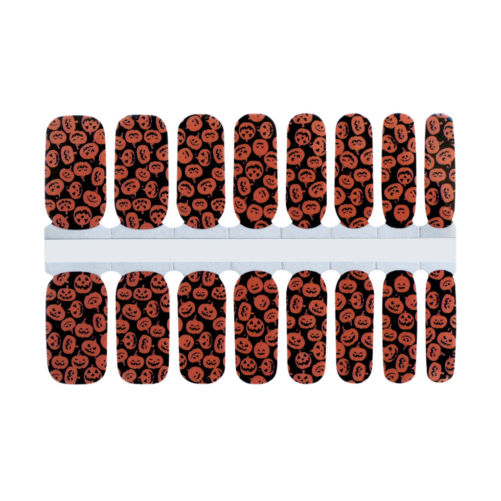 Nails Mailed's 'Hey There Pumpkin' Halloween Gel Nail Wraps: Spooky Jack-o'-Lanterns on a bewitching black base, perfect for festive Halloween nail art.